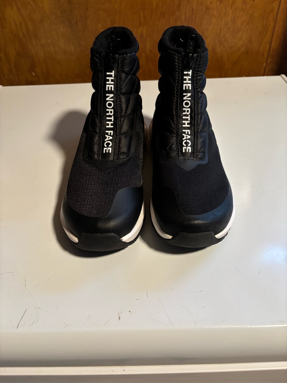 The North Face women Black and White Slip-On Sneakers size 7 but fit size 6